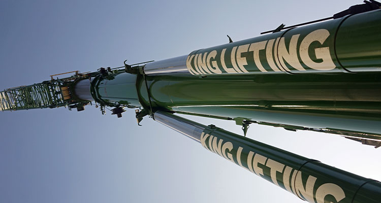 he boom of a crane with the logo "KING LIFTING" visible on it