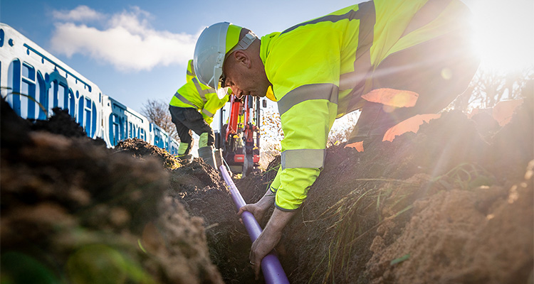 workers from Fibrus installing full fibre broadband in a rural area.