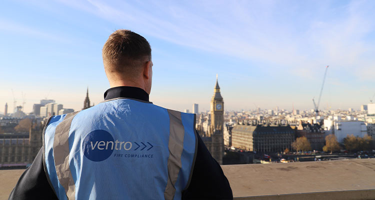 an employee of Ventro Group Ltd. standing on a rooftop overlooking London, with the Houses of Parliament and the Elizabeth Tower visible in the background