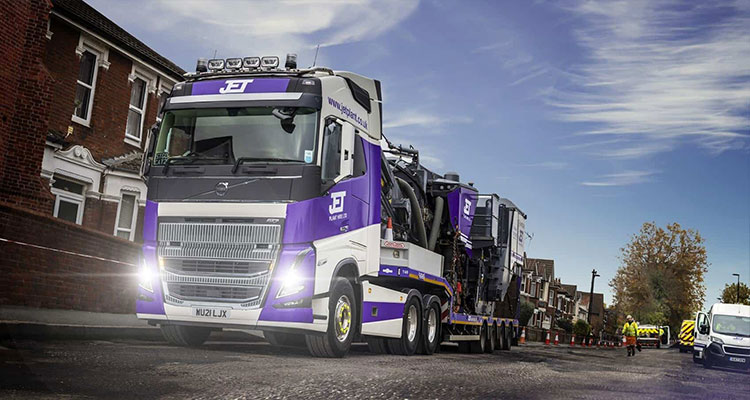 a large, modern Volvo FH Globetrotter low-loader truck operated by Jet Plant Hire Ltd