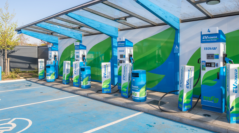 Electric car charging point in the UK with vehicles connected as rollout slows
