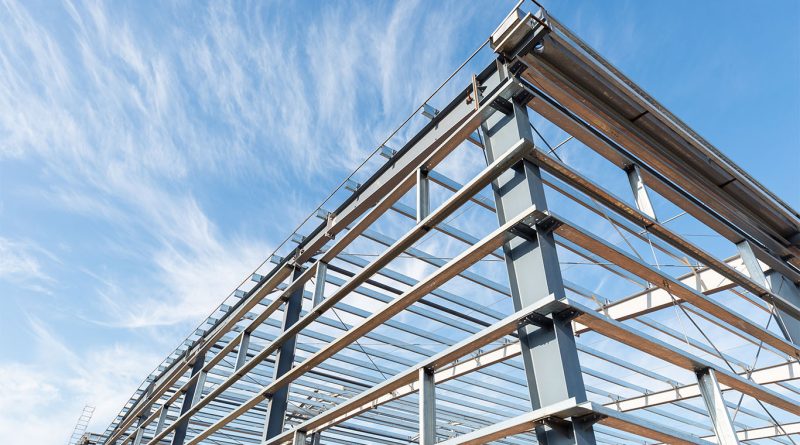 Industrial construction site on Teesside with steel framework under assembly, highlighting supply chain tensions in UK net zero projects.