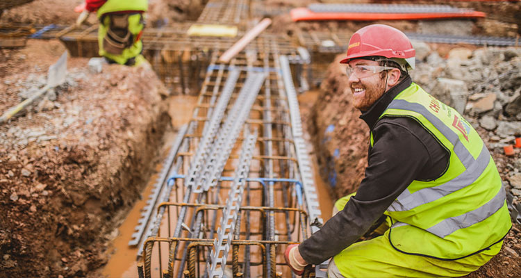 workers on a construction site, involved in a groundworks or piling project
